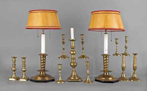 Appraisal: Collection of brass candlesticks to include a pair of Queen