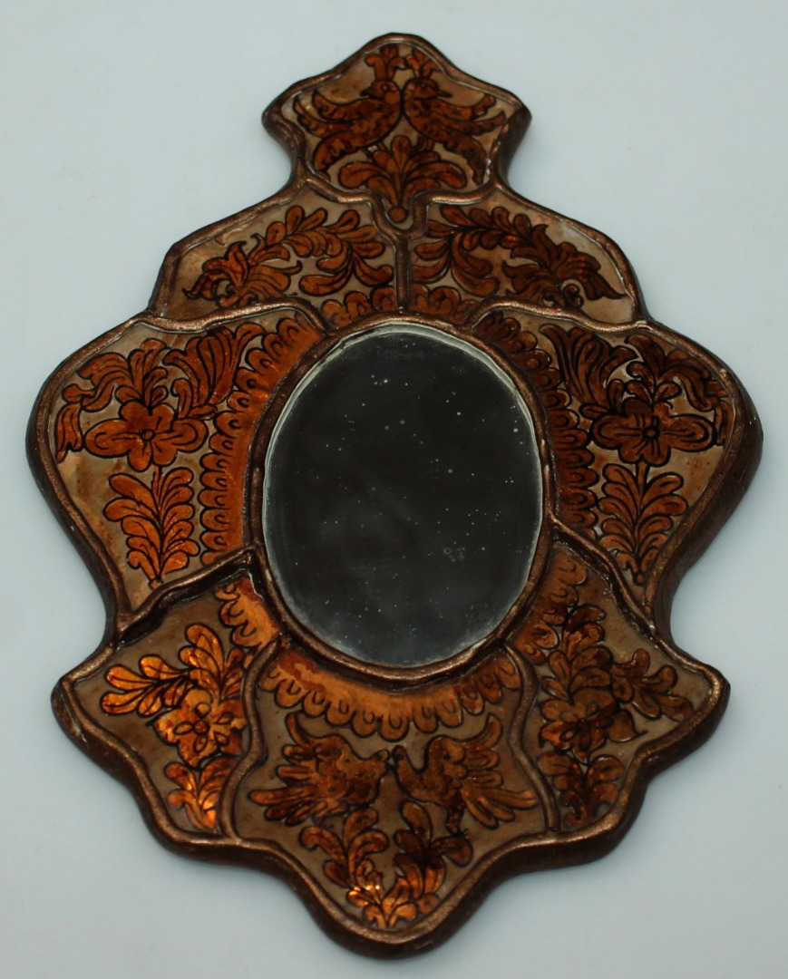 Appraisal: An unusual late thC early thC mirror with a shaped