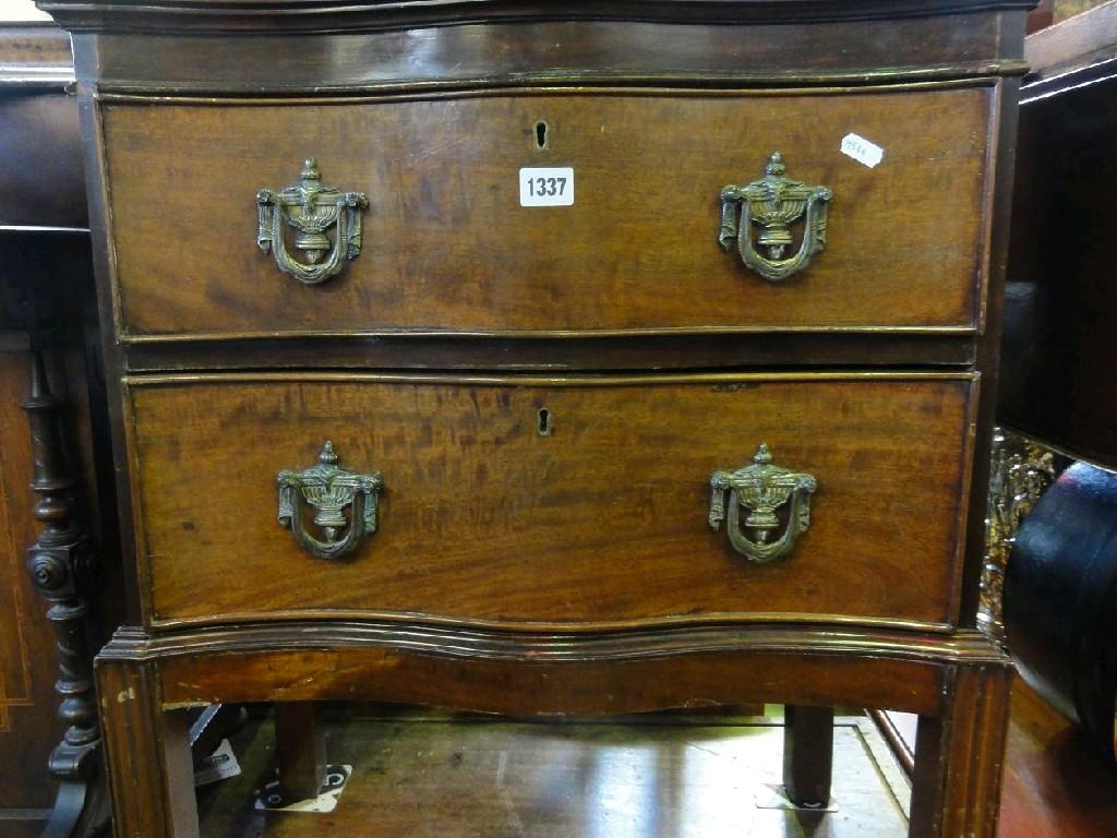 Appraisal: A small th century mahogany two drawer chest with serpentine