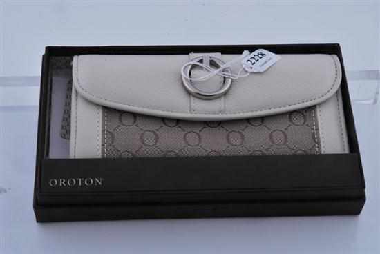 Appraisal: A WHITE LEATHER AND CANVAS WALLET BY OROTON