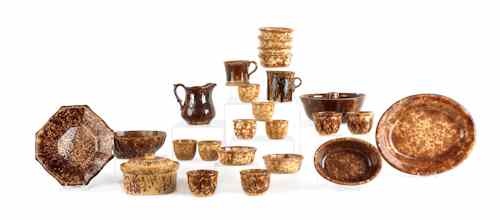 Appraisal: Twenty-four pieces of Bennington type pottery th c to include