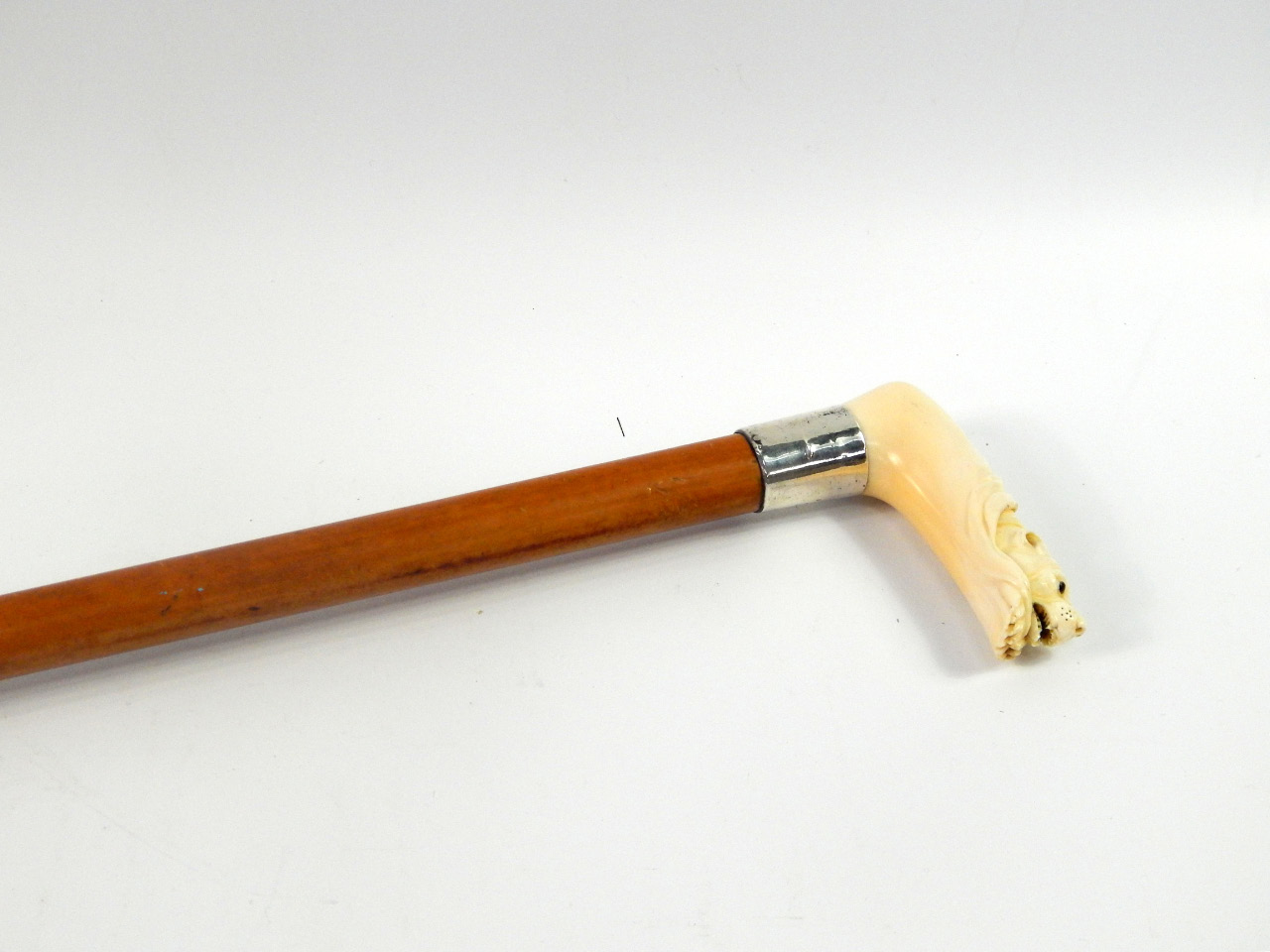 Appraisal: A Victorian malacca and ivory handled walking stick carved as