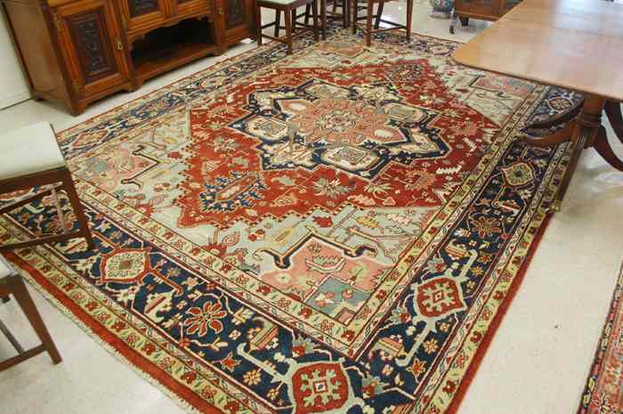 Appraisal: HAND KNOTTED ORIENTAL CARPET Persian Serapi design floral and floral