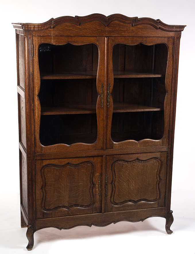 Appraisal: FRENCH-STYLE LIBRARY BOOKCASE European th century oak Scalloped and shaped