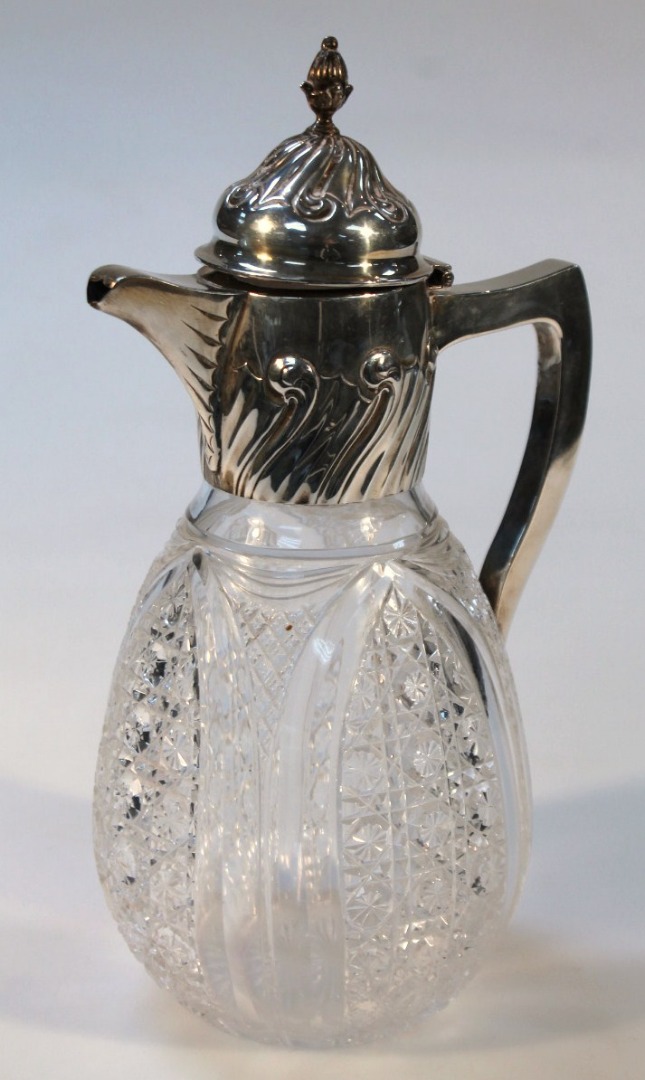 Appraisal: A Victorian silver and cut glass claret jug with a