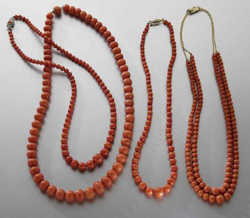 Appraisal: Chinese carved red coral necklaces This item can NOT be