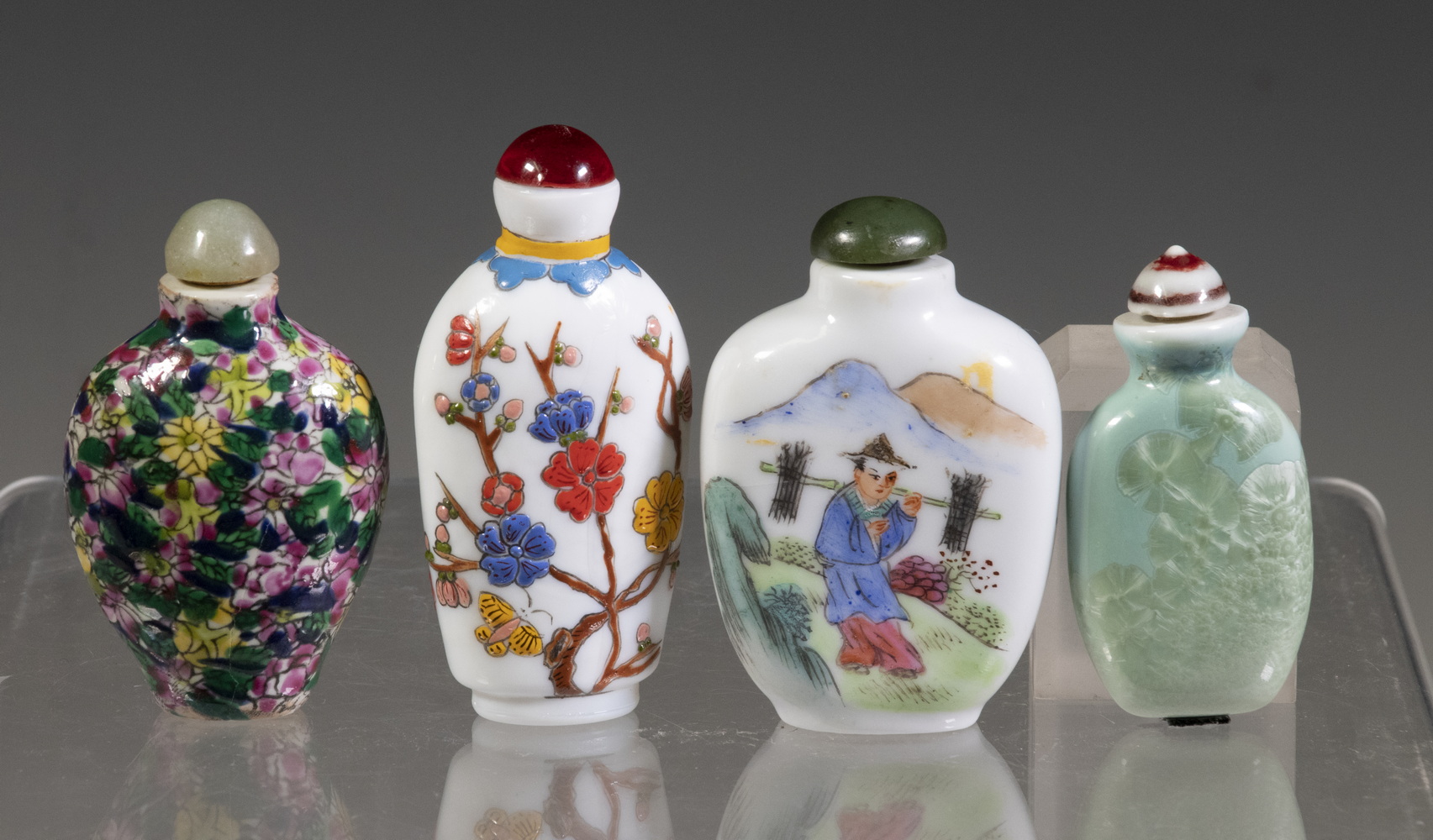 Appraisal: CHINESE SNUFF BOTTLES Including th c floral decoration porcelain bottle