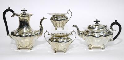 Appraisal: AN EDWARDIAN FOUR PIECE TEA SET of shaped inverted baluster