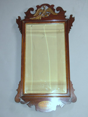 Appraisal: An Edwardian mahogany fretwork wall mirror in the Chippendale style