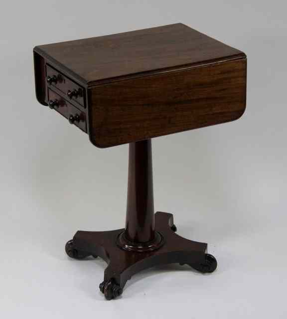 Appraisal: A George IV mahogany two-flap work table fitted two drawers