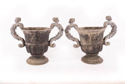 Appraisal: A pair of two-handled lead urns cm high