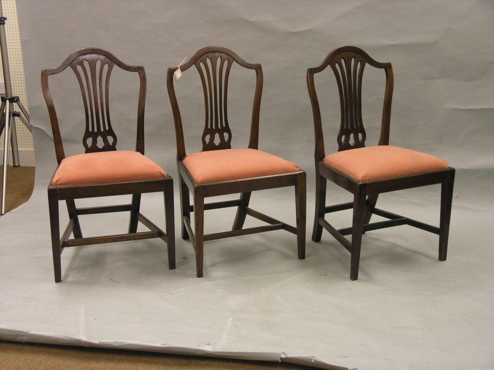 Appraisal: A set of three Hepplewhite period mahogany dining chairs camel