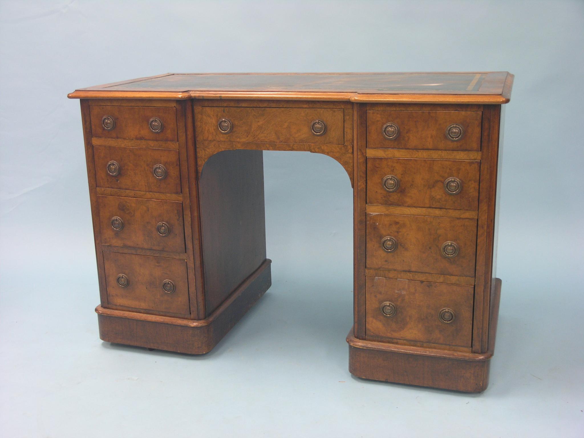 Appraisal: A Victorian burr walnut desk inset gilt-tooled leather top above