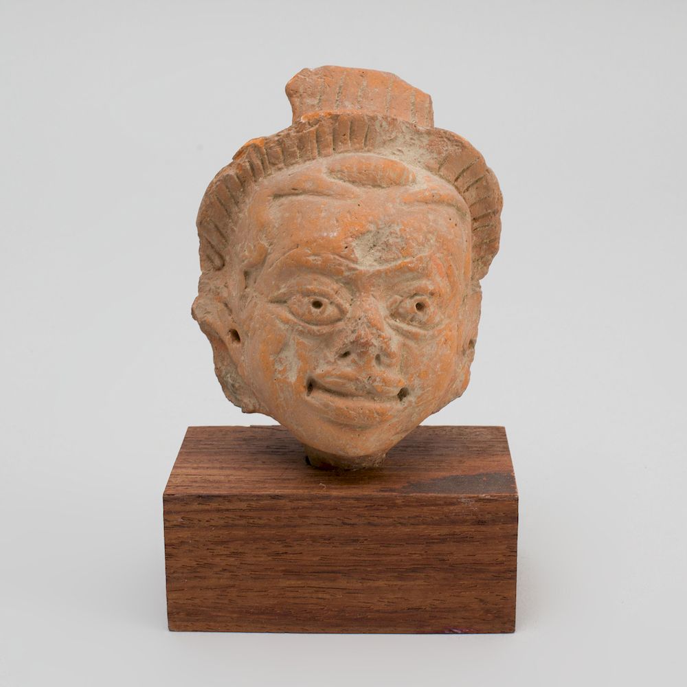 Appraisal: Indian Terracotta Head of a Man Now raised on a