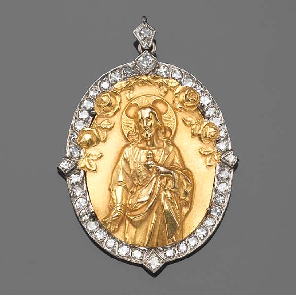 Appraisal: A diamond and k bicolor gold religious pendant center cruciform