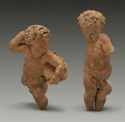 Appraisal: Two terra cotta putti one holding tambourine probably th century