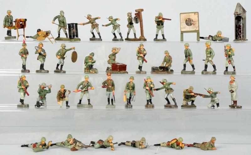 Appraisal: Lineol Elastolin German Army Fighting Soldiers Includes composition soldiers in