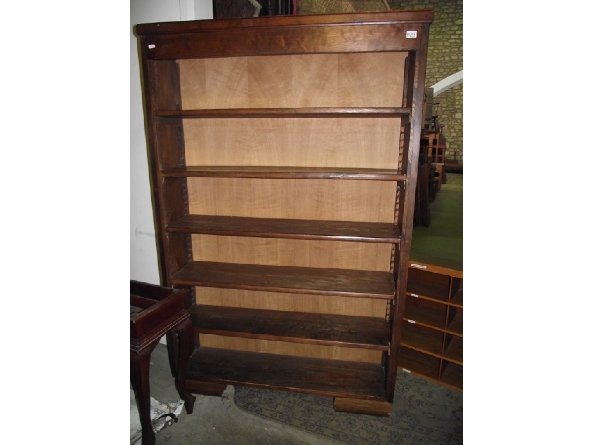 Appraisal: A stained pine framed freestanding open bookcase with five adjustable