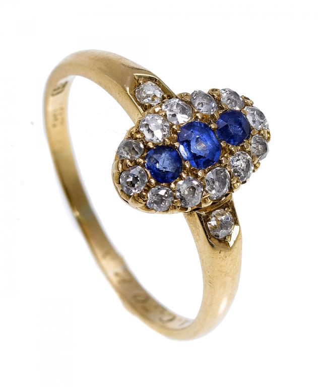 Appraisal: A SAPPHIRE AND DIAMOND RING the row of three sapphires