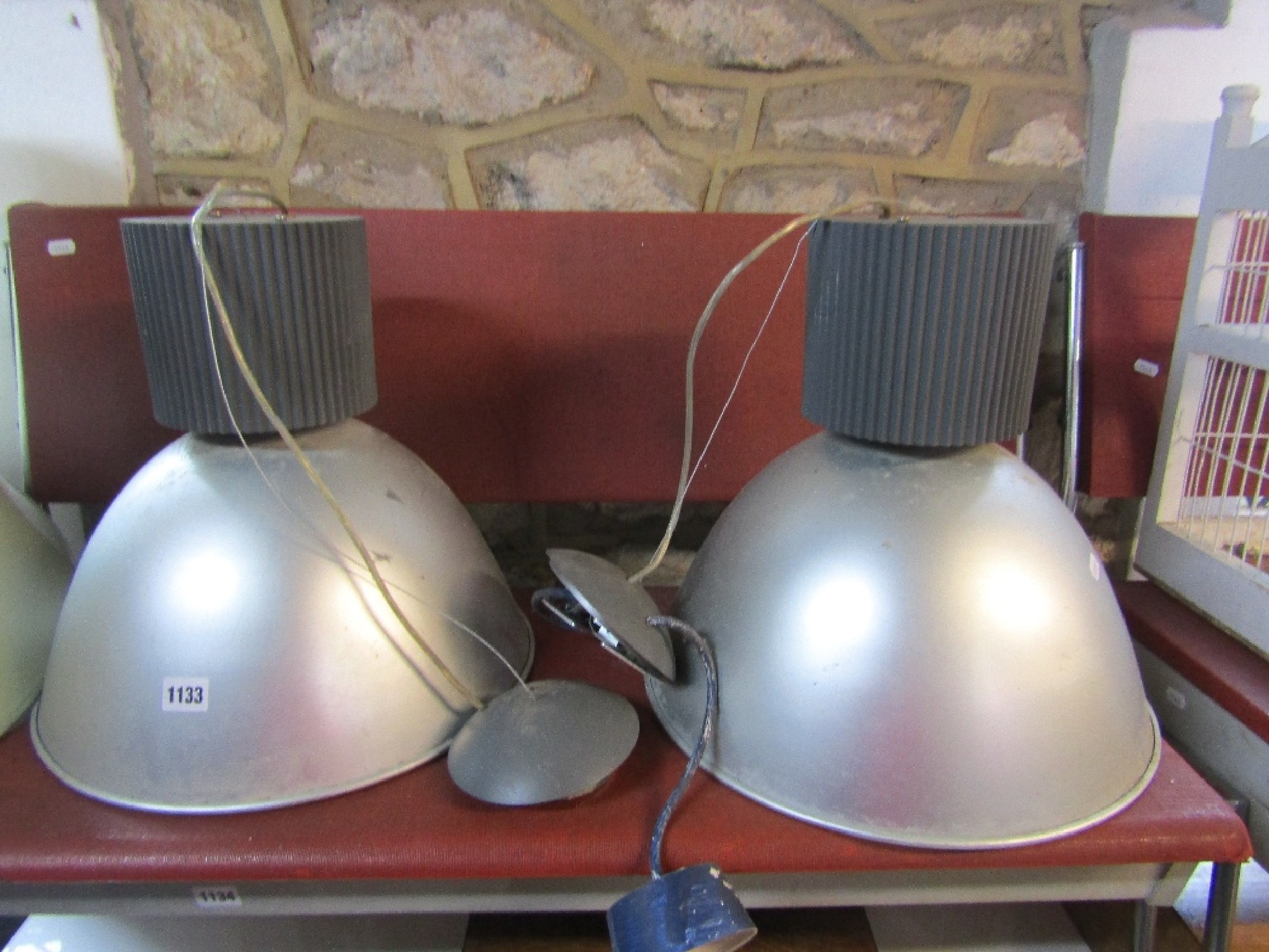 Appraisal: A pair of contemporary industrial style hanging ceiling lights with