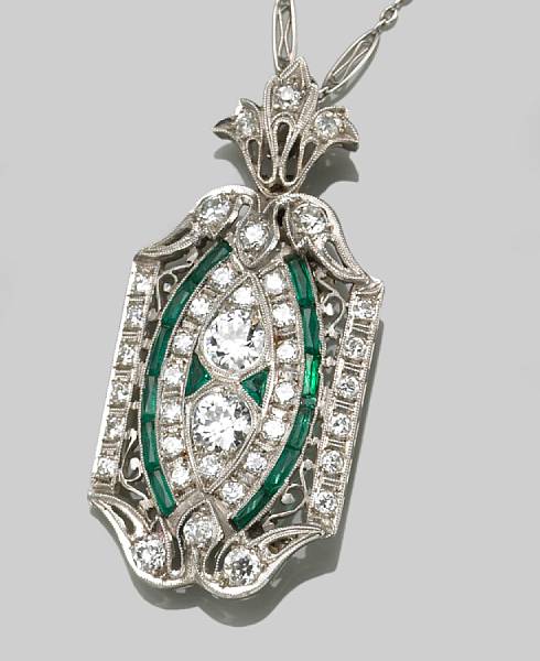 Appraisal: A diamond emerald and platinum pendant-brooch with diamond and platinum