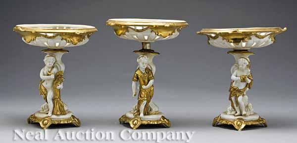 Appraisal: Three German Porcelain Gilt-Decorated Cherub Tazzas late th c with