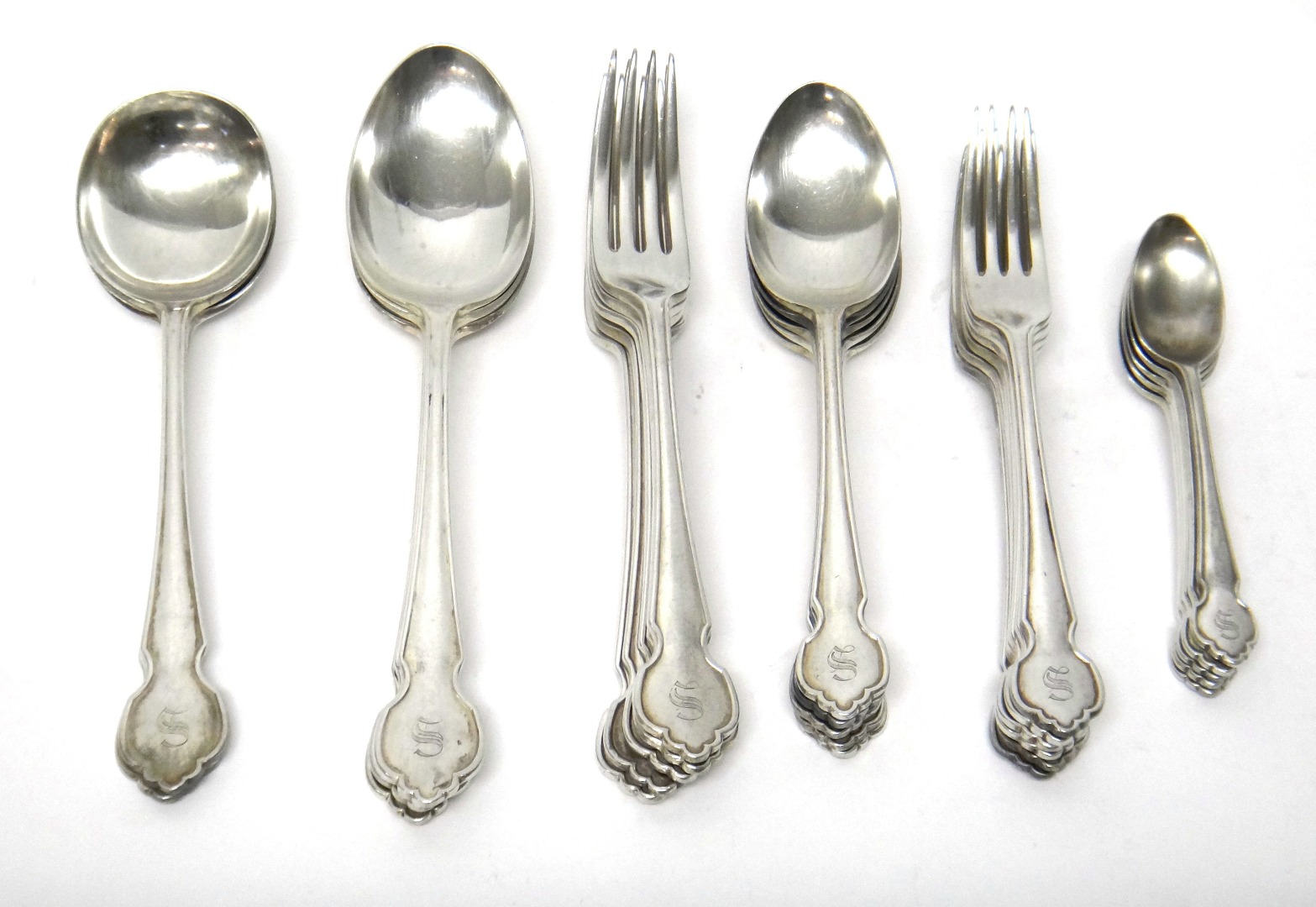 Appraisal: A silver part table service comprising three tablespoons Birmingham five