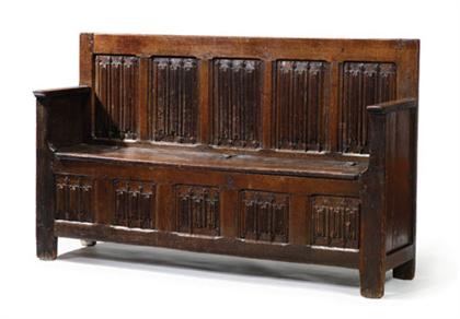 Appraisal: English oak linenfold carved settle th century The rectangular backrest