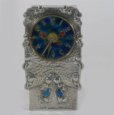 Appraisal: A Liberty Co Tudric Pewter and enamel mantle clock designed