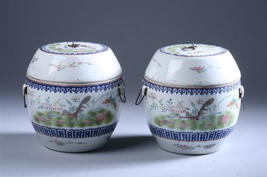 Appraisal: PAIR CHINESE EXPORT FAMILLE ROSE BARREL-FORM COVERED PORCELAIN JARS Qing