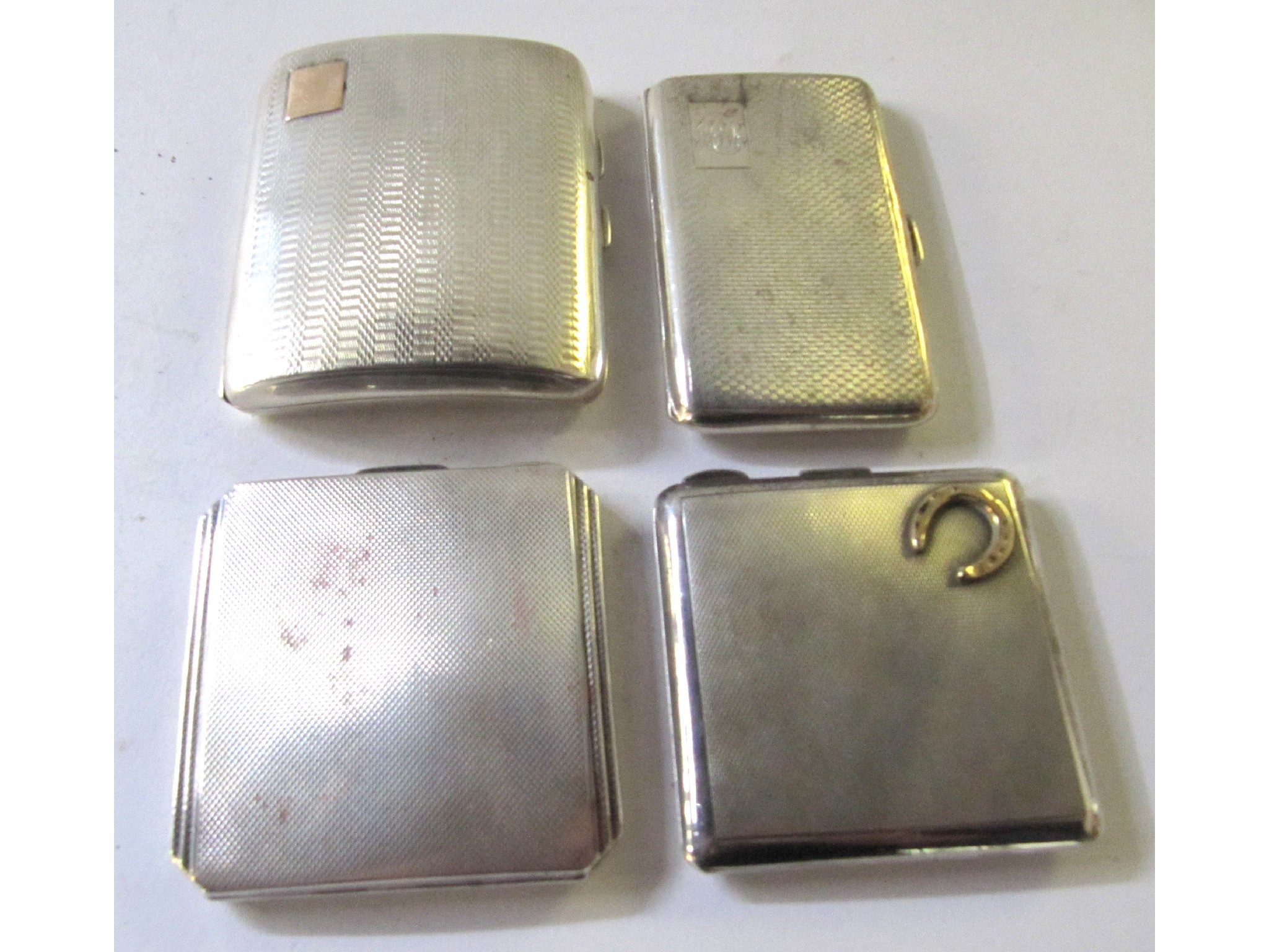 Appraisal: A lot comprising two silver cigarette cases and two silver