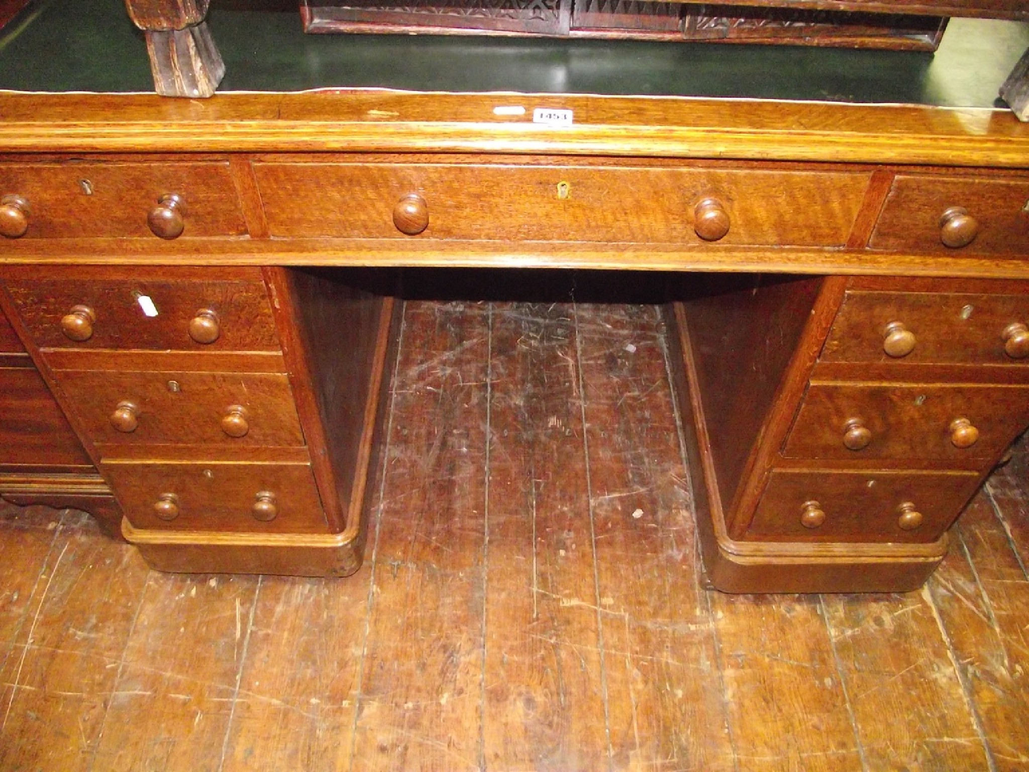 Appraisal: A late th century oak pedestal writing desk fitted with