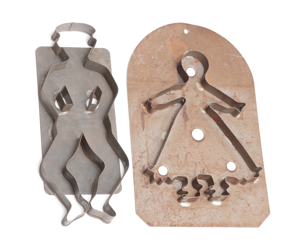 Appraisal: TWO LARGE TIN COOKIE CUTTERS Twentieth century Woman in a