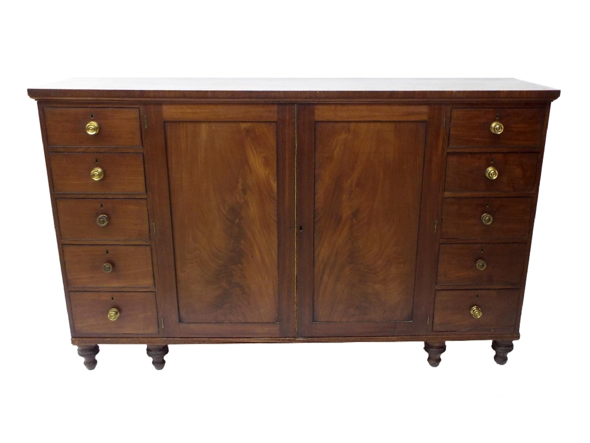 Appraisal: th century flame mahogany compactum centrally fitted with two panelled