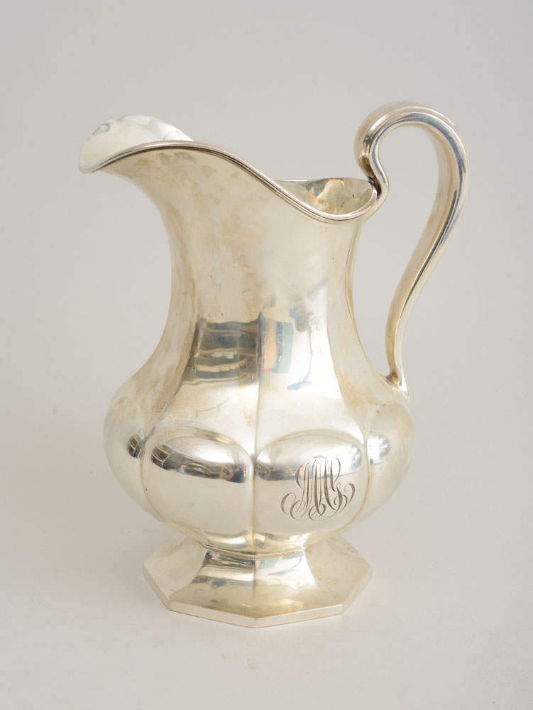 Appraisal: REED AND BARTON MONOGRAMMED SILVER WATER PITCHER The octagonal pear-form