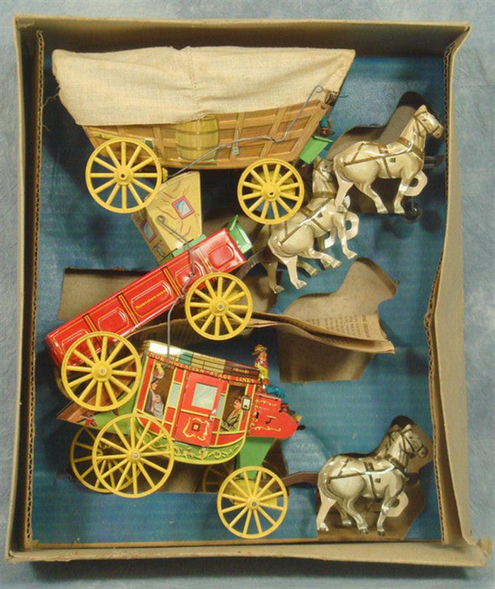 Appraisal: Southwestern Products Early American Transportation tin litho wagons set of