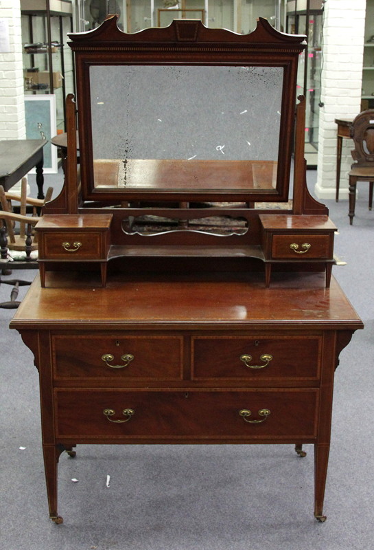 Appraisal: An Edwardian mahogany and satinwood banded dressing chest the mirror