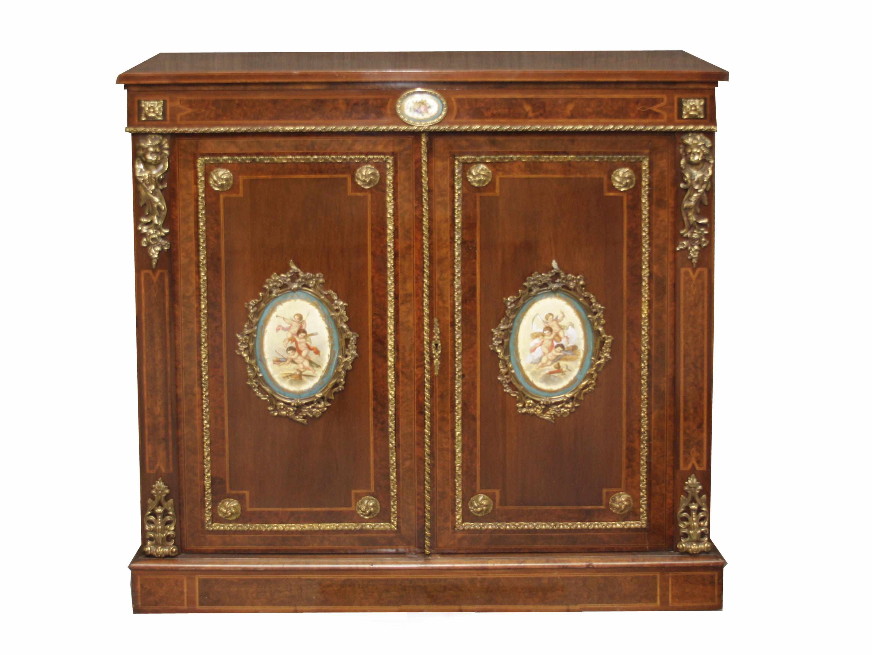 Appraisal: A French gilt bronze and porcelain mounted mahogany side cupboard