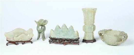 Appraisal: FIVE STONE CARVINGS Asian th century various green stones Cup