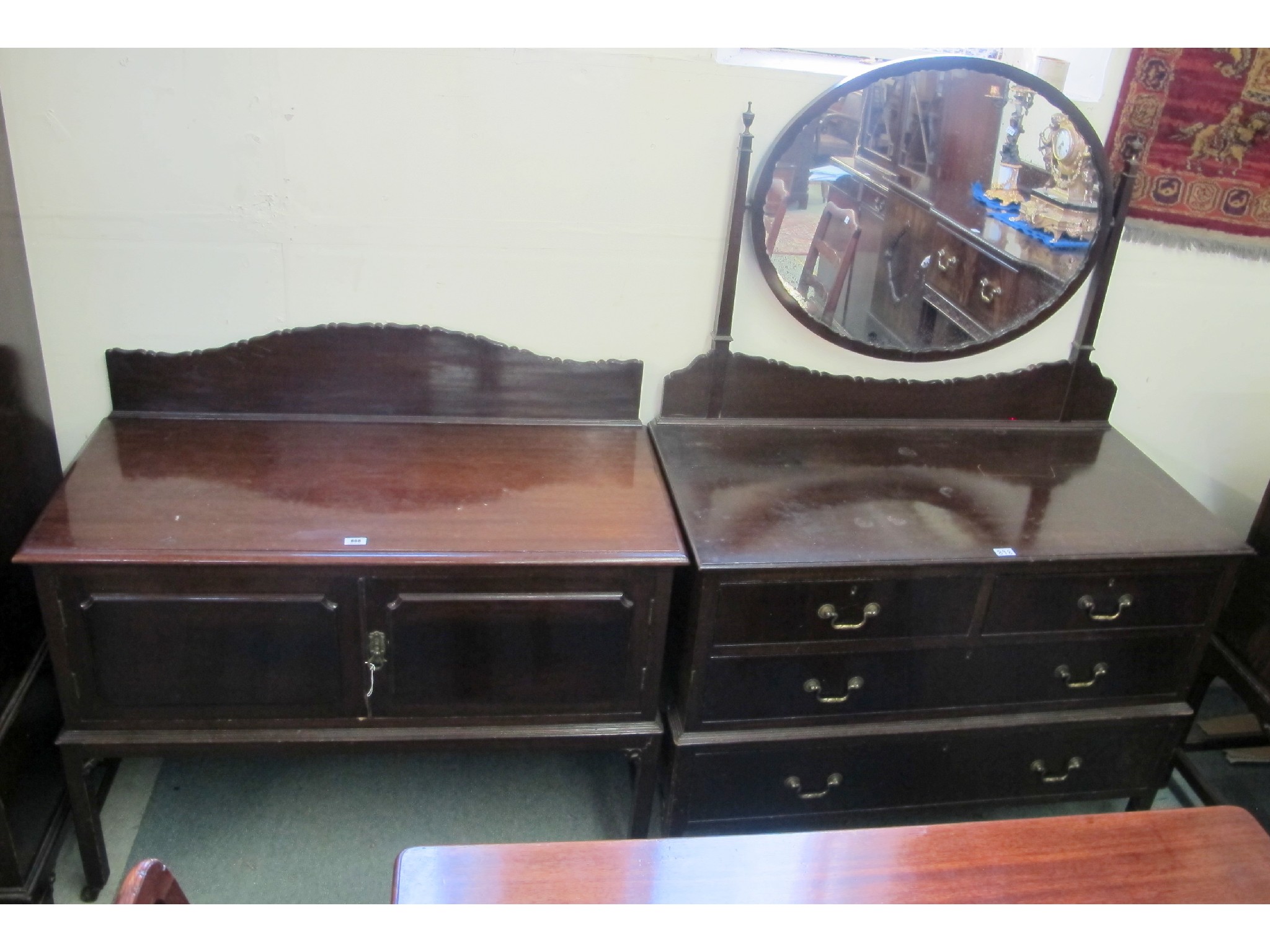 Appraisal: A mahogany triple wardrobe dressing table with oval mirror and