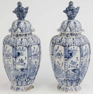 Appraisal: Pair Delft Covered Urns blue and white with foo-dog finials