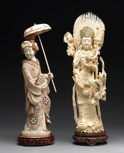 Appraisal: A large pieced and tinted ivory figure of a Japanese