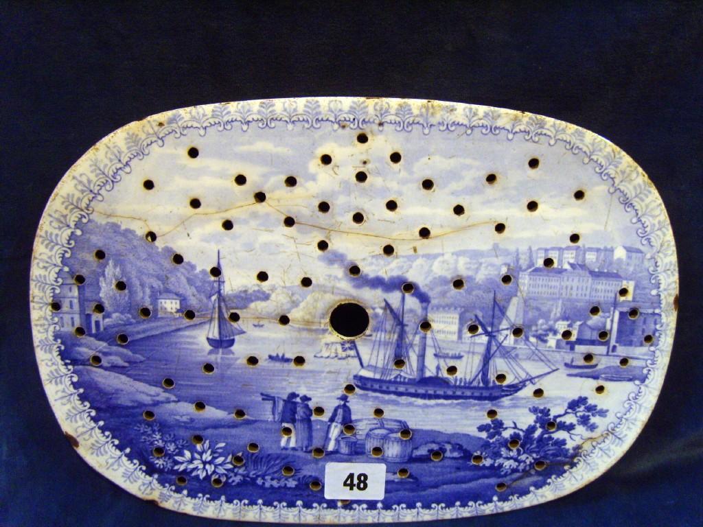 Appraisal: A th century blue and white drainer of oval form