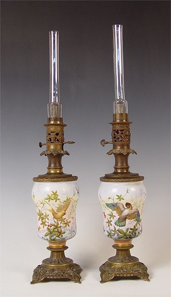 Appraisal: PAIR OF HAND PAINTED FLORAL BIRD OIL LAMPS Hand painted