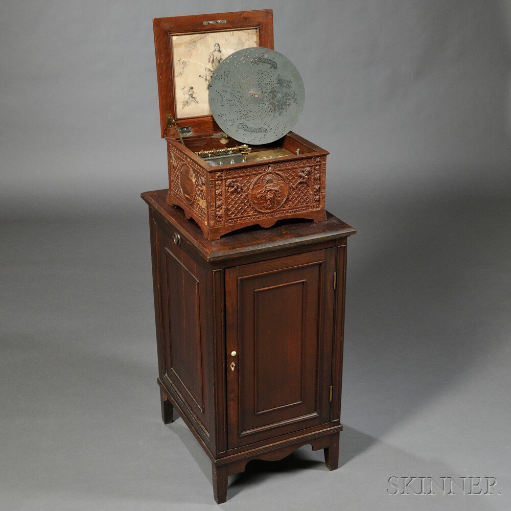 Appraisal: Carved Regina -inch Disc Musical Box and Cabinet c no