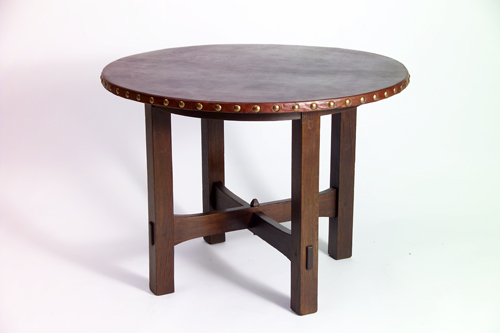 Appraisal: GUSTAV STICKLEY Lamp table with tacked-on circular leather top and