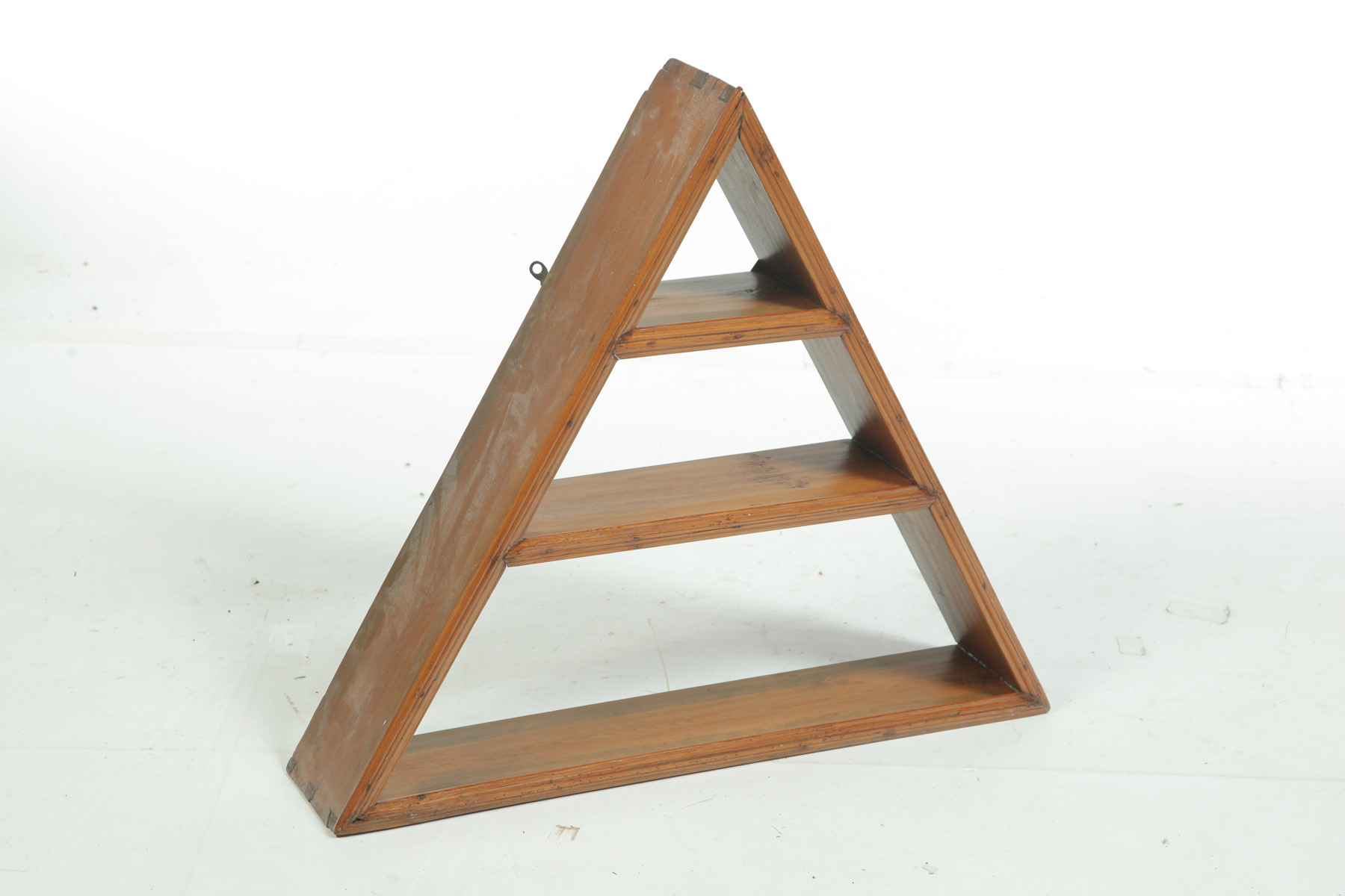 Appraisal: A SHAPED HANGING SHELF American mid th century pine Dovetailed