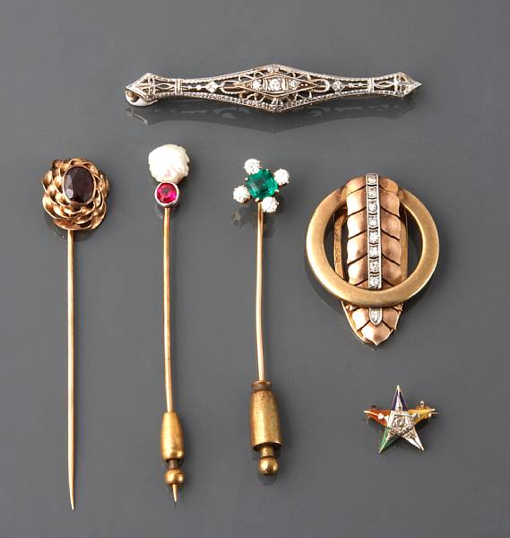 Appraisal: A collection of three gold stick pins and three gold