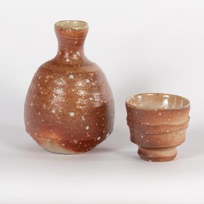 Appraisal: Phil Rogers British born a sake set in chestnut lustre