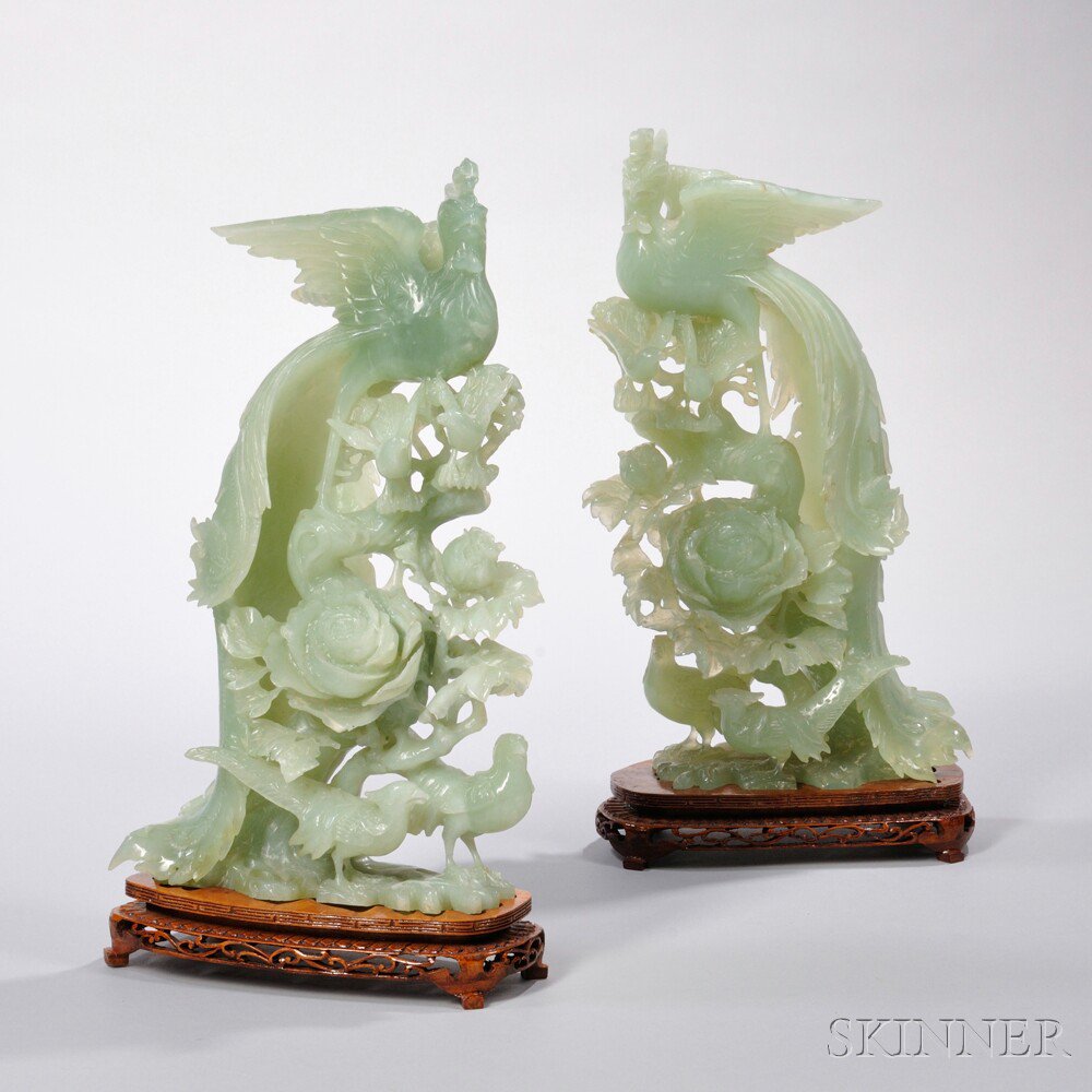 Appraisal: Pair of Hardstone Phoenixes China each perched on a pine